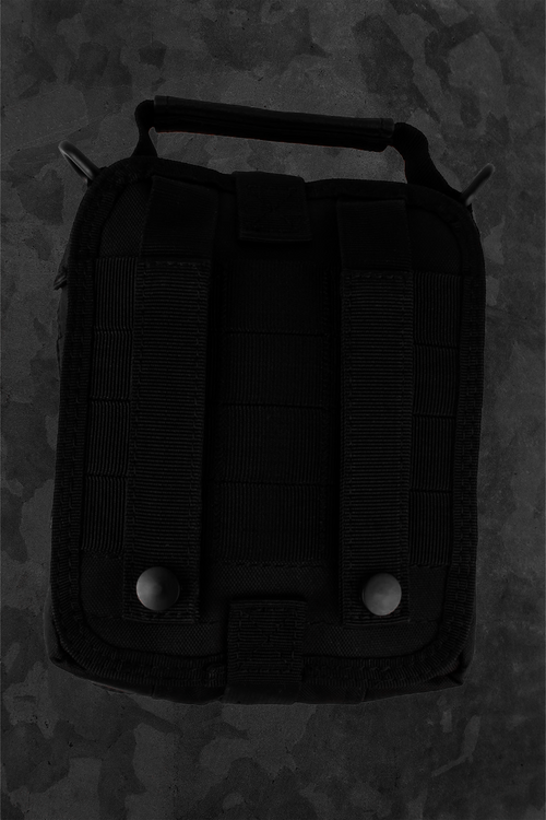 Black tactical repair kit bag on a dark camouflage background