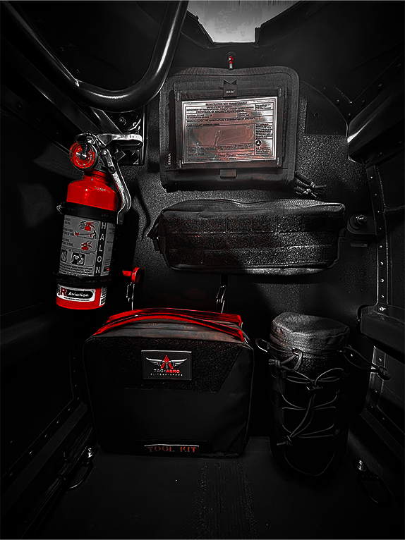 Tool kit and fire extinguisher attached to a Molle Rack in a vehicle's cargo area