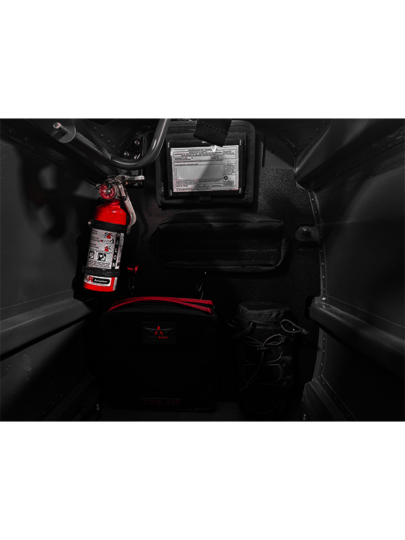 Tool kit and fire extinguisher attached to a Molle Rack in a vehicle's cargo area