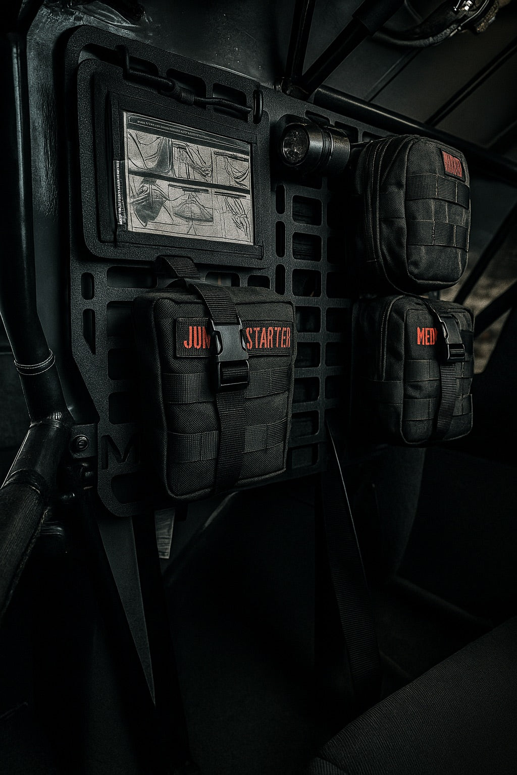 Close up of a Molle Rack setup with jump start and medical kits