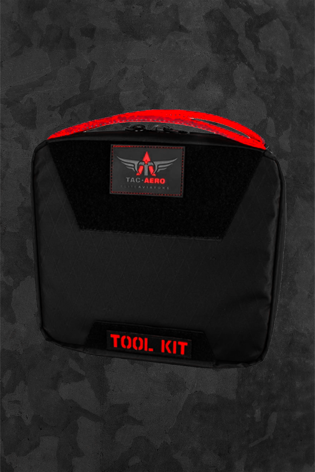 Black tool kit with red accents on a camouflage background