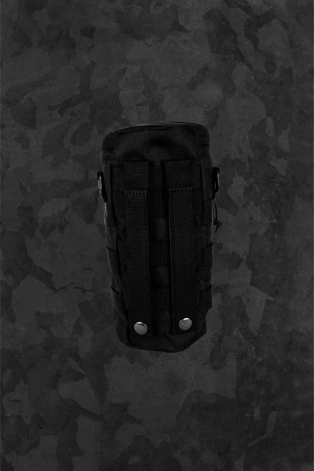Black tactical pouch on a camouflage background